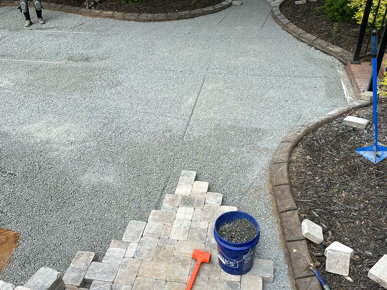Paver patio with a built-in fire pit, tight joints and clean edges.