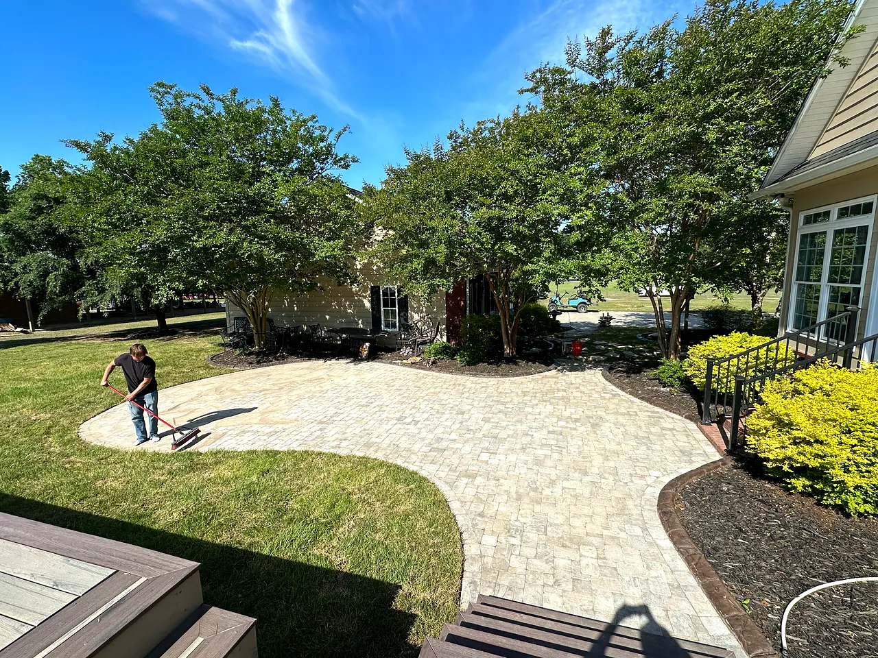 Curved paver walkway winding through fresh, maintained landscaping in the Grand Strand.